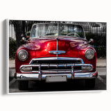 Vintage poster art of a classic car in vibrant colors on a large framed canvas, ideal for living room decor.