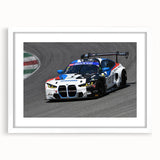 Abstract art print of vintage cars in muted gray and blue tones, framed with a white mat, suitable for dining room decor.