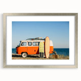Abstract art print of a caravan in muted earth tones on a framed silver mat, suitable for bedroom or dining room decor.