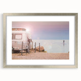 Abstract art print featuring a caravan in muted earth tones on a framed silver mat, ideal for dining room decor.