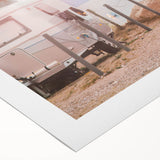 Art deco poster of a vintage caravan in muted gold and black, printed on rolled canvas, suitable for dining room decor.