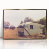 Mid-century modernist art depicting a caravan in muted earth tones on a framed acrylic, suitable for nursery wall decor.