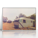 Mid-century modernist caravan depicted in muted colors on a white-framed acrylic print, suitable for nursery wall art.
