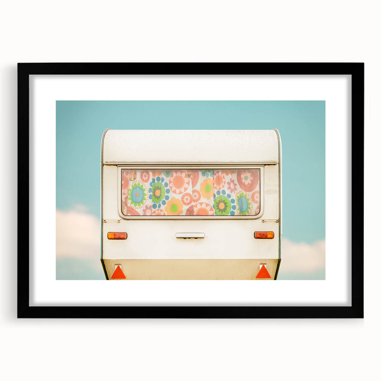 Extra large abstract art print of a colorful caravan scene on textured canvas, framed in black, ideal for living room decor.