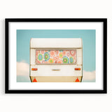 Extra large abstract art print of a colorful caravan scene on textured canvas, framed in black, ideal for living room decor.