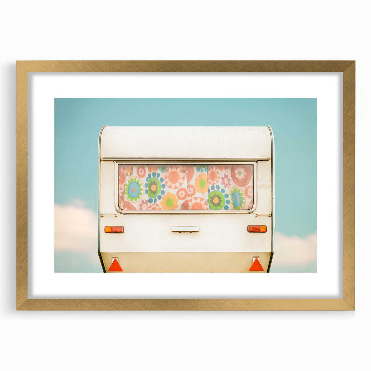 Textured abstract art print of a caravan in muted earth tones on a gold-framed canvas, suitable for bedroom decor.