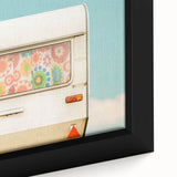 Framed canvas featuring a close-up view of a black textured caravan with colorful detailing.
