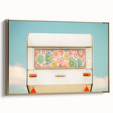 Framed canvas featuring a vintage caravan in a colorful landscape, ideal for living room decor.