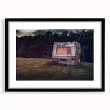 Abstract art print of a colorful, textured caravan scene on a large framed canvas, ideal for living room decor.