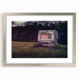 Abstract art print of a caravan in muted earth tones on a framed canvas, suitable for dining room decor.