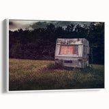 Framed canvas featuring a vintage caravan in a landscape setting with muted earth tones, ideal for bedroom wall art.
