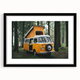 Abstract art print featuring a colorful, textured caravan design in a black frame.