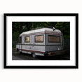 Extra large abstract art print of a colorful caravan, textured with muted tones on black framed canvas.