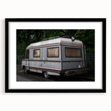 Extra large abstract art print of a colorful caravan, textured with muted tones on black framed canvas.