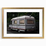 Textured art print of an abstract caravan in muted earth tones on a framed canvas, suitable for bedroom decor.
