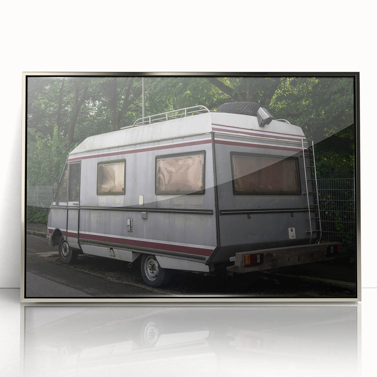 Art deco poster of a vintage caravan in monochrome tones on a silver-framed acrylic, ideal for nursery wall art.