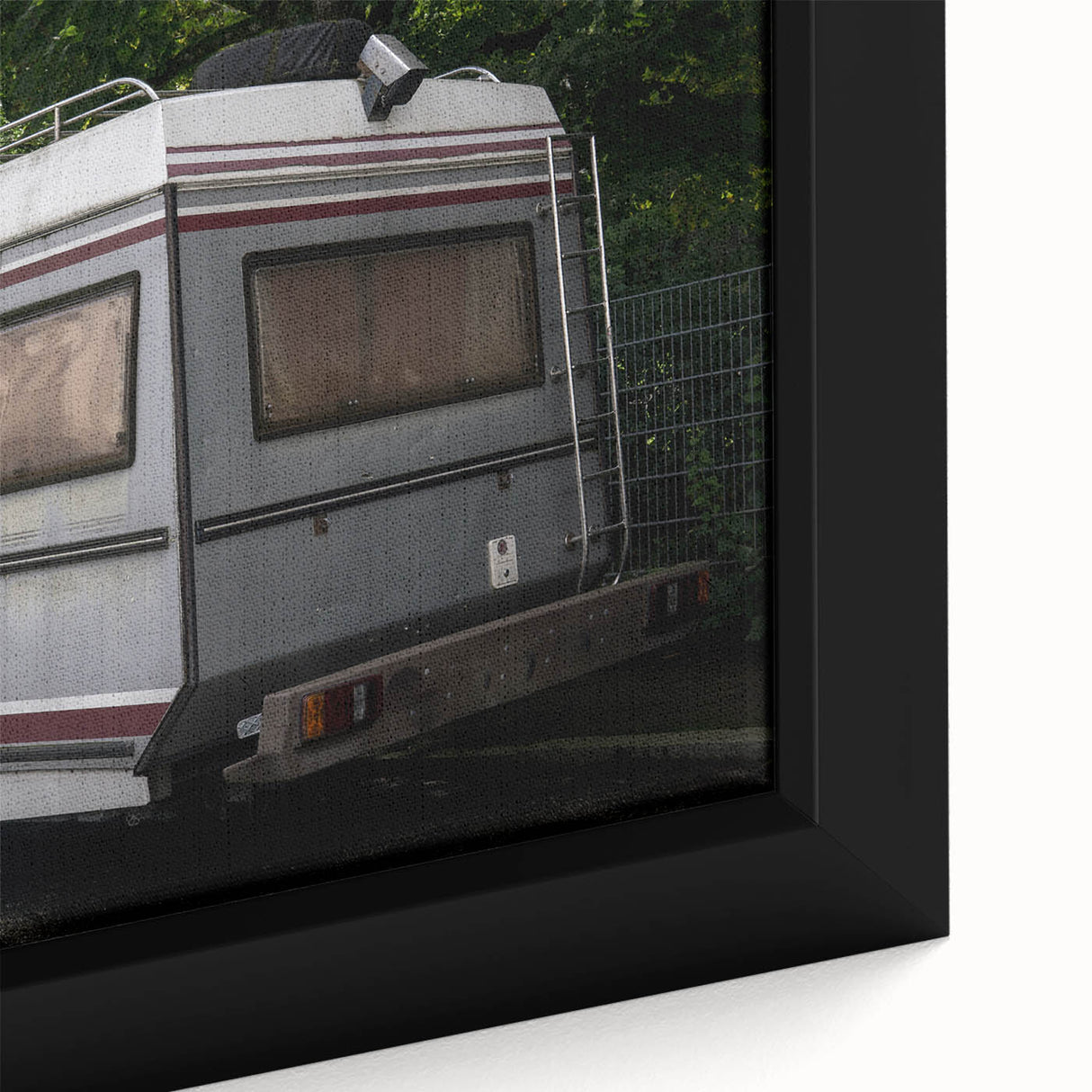Black wall art depicting a caravan scene with colorful, textured details on a large framed canvas.
