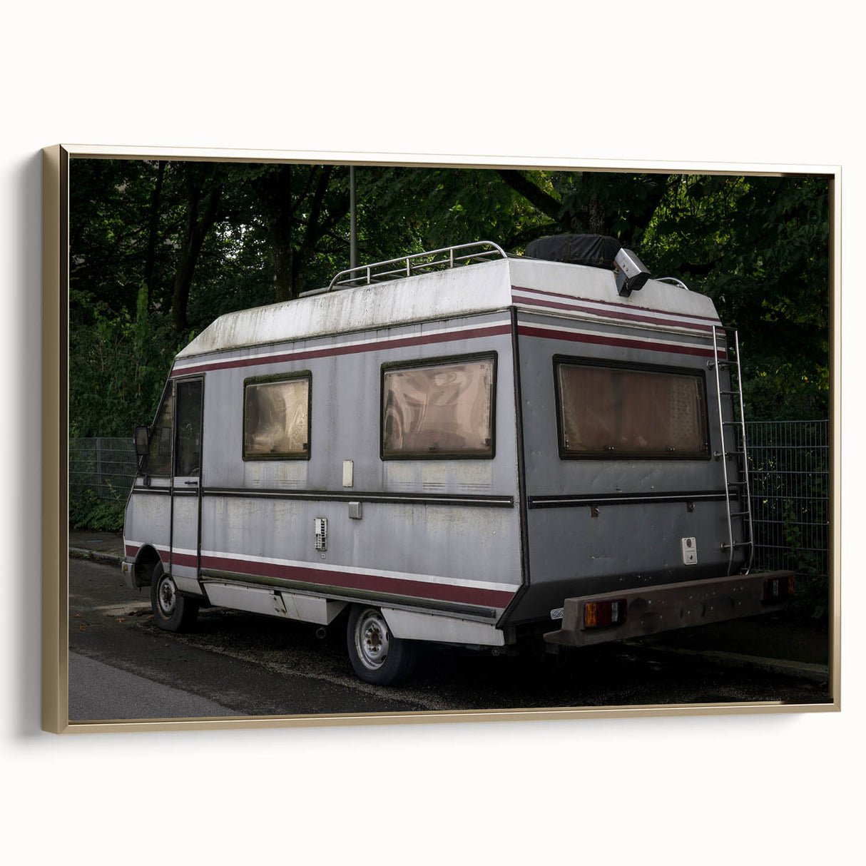 Framed canvas featuring a vintage caravan in a colorful landscape, ideal for decorating a living room or hallway.