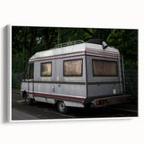 Framed canvas featuring a black and white vintage poster of a caravan landscape, ideal for bedroom wall art.