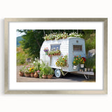 Abstract art print of a caravan in muted gray and blue tones, framed with a silver mat, suitable for dining room decor.