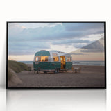 Large abstract wall art depicting a colorful mid-century modernist caravan scene on a black framed acrylic print.