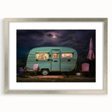Abstract art print of a caravan in muted earth tones on a silver-framed canvas, suitable for dining room decor.
