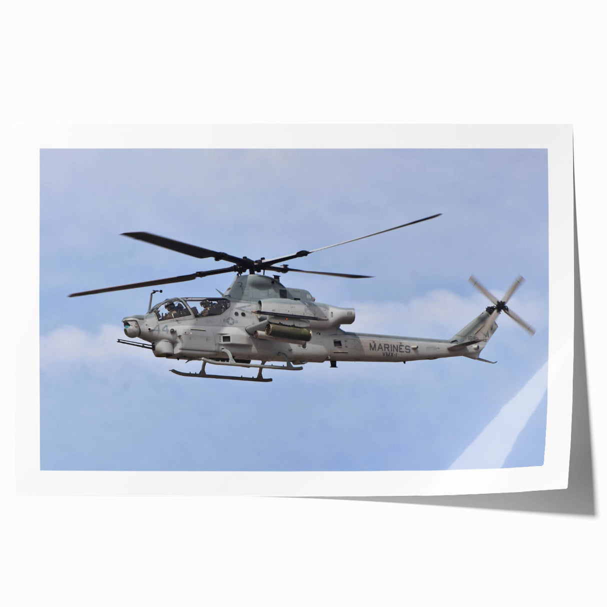 Rolled print of a helicopter in flight, rendered in grayscale, suitable as art wall dining room decor.