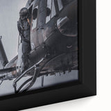 Close-up of a black textured helicopter on framed canvas with vibrant color accents, ideal for living room decor.