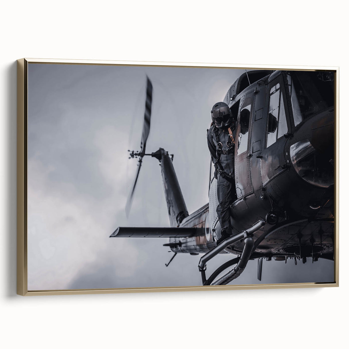 Side view of a vintage helicopter on gold-framed canvas, featuring black and gray tones, ideal for bedroom wall art.