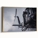 Side view of a vintage helicopter on gold-framed canvas, featuring black and gray tones, ideal for bedroom wall art.