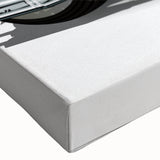 Black and white photograph of a vintage motorcycle on stretched canvas, suitable for bedroom wall decor.