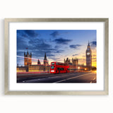 Textured abstract art print of service vehicles in muted gray and silver tones, framed with a silver mat.