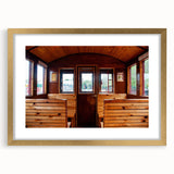 Extra large abstract art print featuring textured design of service vehicles in muted earth tones, framed in gold.