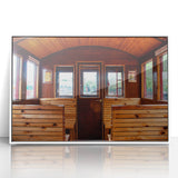 Art deco poster featuring a collection of stylized vintage vehicles in muted colors on a framed acrylic.