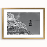 Extra large abstract art print featuring a textured design of service vehicles in muted earth tones on a gold-framed canvas.