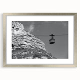 Textured art print featuring abstract, overlapping transportation motifs in cool gray tones.