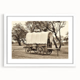 Abstract art print of colorful service vehicles on white framed canvas, suitable for dining room decor.