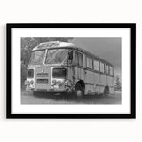 Abstract art print featuring a colorful, textured depiction of service vehicles, in a large black frame.