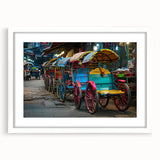 Abstract art print featuring multicolored service vehicles on white framed canvas, suitable for dining room decor.