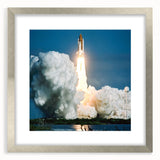 Abstract art print of a spacecraft in silver, gray, and black tones on a framed poster.