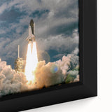 Framed canvas featuring a textured depiction of a spacecraft with vibrant accents on a black background.