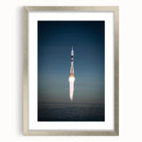 Abstract art print of a spacecraft in muted metallic tones on a silver-framed mat, ideal for dining room decor.