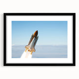 Abstract art print of colorful spacecraft in textured style on a large black-framed canvas, ideal for living room decor.