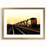 Extra large abstract art print of a textured train, in muted earth tones on a gold-framed canvas.