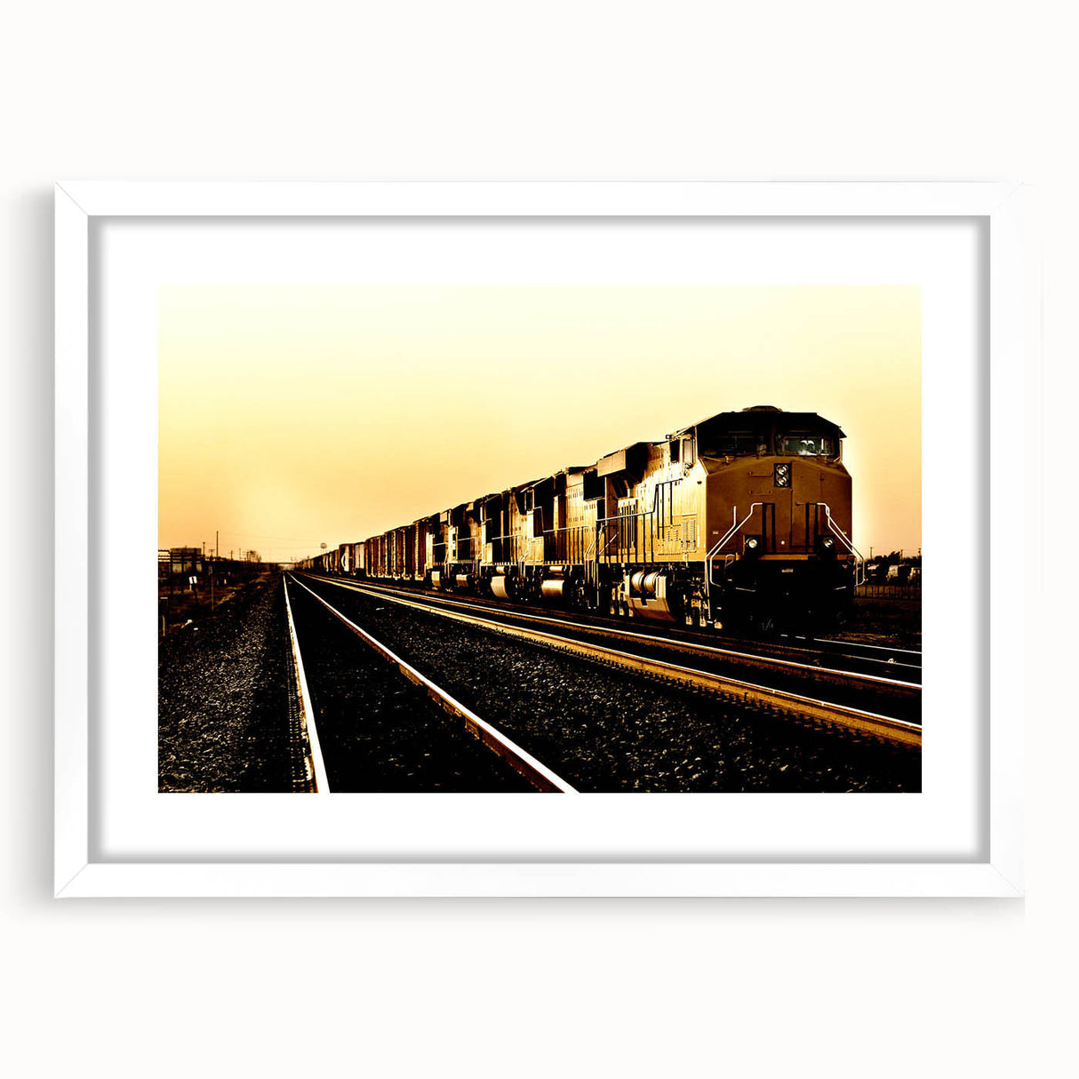 Abstract art print of a stylized train in monochrome, framed in white, ideal for modern bedroom or dining room.