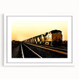 Abstract art print of a stylized train in monochrome, framed in white, ideal for modern bedroom or dining room.