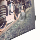 Large abstract wall art of a train in mid-century modernist style on acrylic glass, with muted colors.