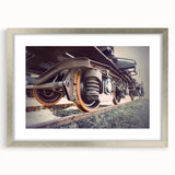 Textured abstract art print of a train, in muted gray and silver, framed with a silver mat, ideal for modern bedroom decor.