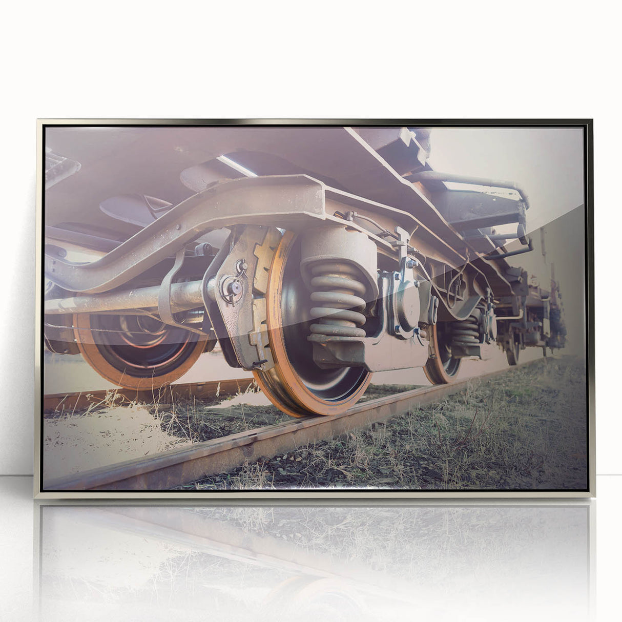 Mid-century modernist art deco train poster in silver frame, featuring muted gray and blue tones.