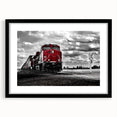 Colorful, abstract art print of a stylized train, in a black frame, suitable for extra large living room decor.